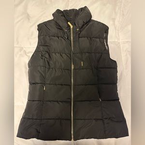 Calvin Klein woman’s black puffer vest, size medium